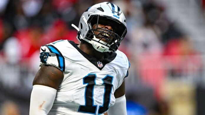 Panthers' Scourton carted off with knee injury on 1st day of camp