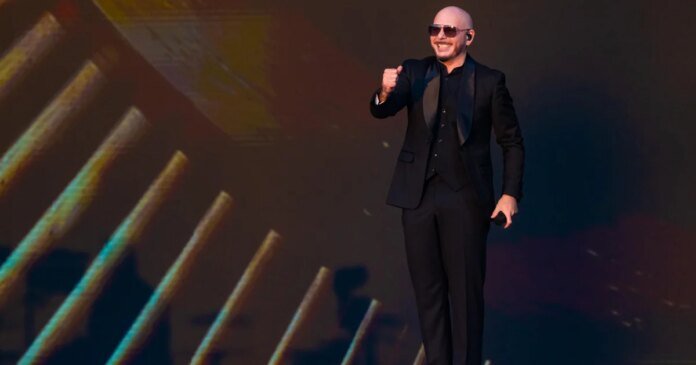Pitbull sets Guinness World Record for largest gathering of people wearing bald caps