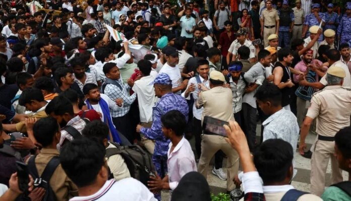 Police cane supporters of India's cockroach movement as thousands gather for march