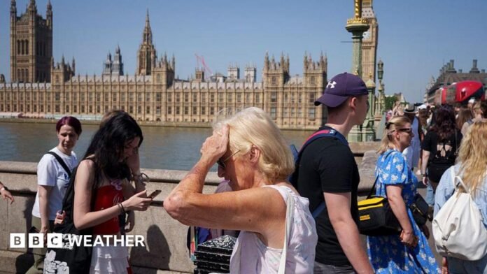 People walking along the South Bank in London, during June's extreme heatwave