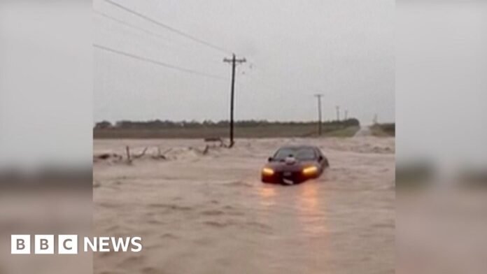 A car is under water in Texas.