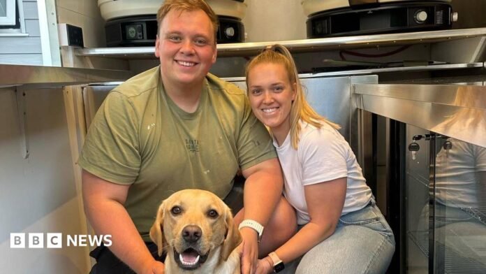 Max and Hannah pose with their dog