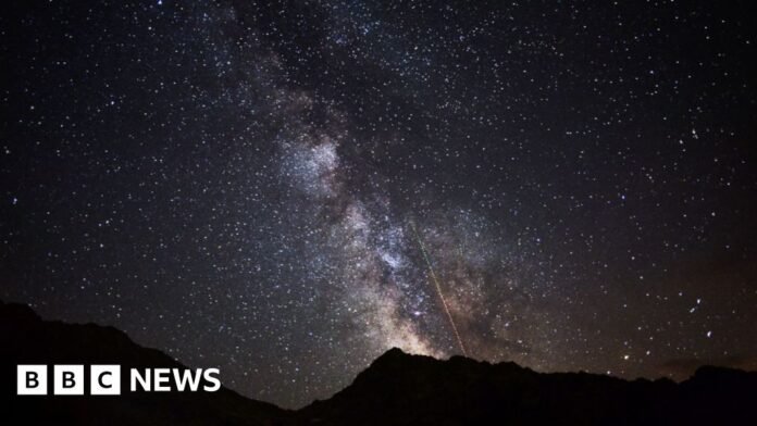 The Perseids meteor shower with the Milky Way galaxy.