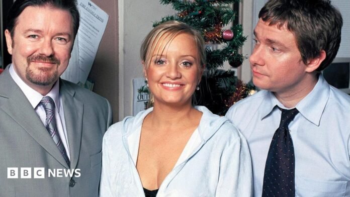 Actors Ricky Gervais as David Brent, Lucy Davis as Dawn and Martin Freeman as Tim in The Office