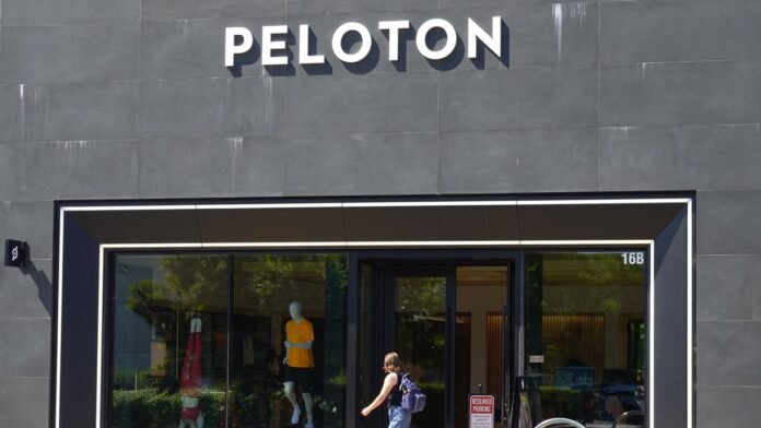 Peloton posts first-ever annual net profit, but shares drop as outlook disappoints