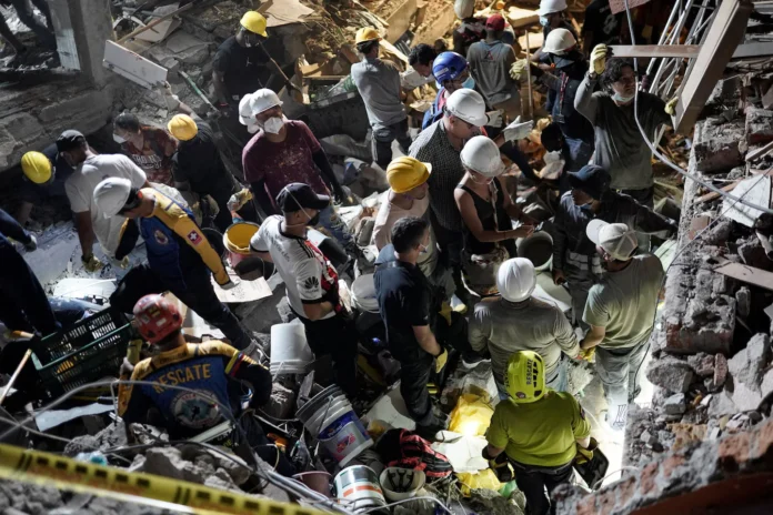 Rescuers search collapsed hospitals for patients trapped by Colombia quake