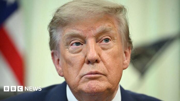 US President Donald Trump looks on before signing an executive order calling for more research and flexibility on vaccines, in the Oval Office of the White House in Washington, DC, on August 10, 2026. 